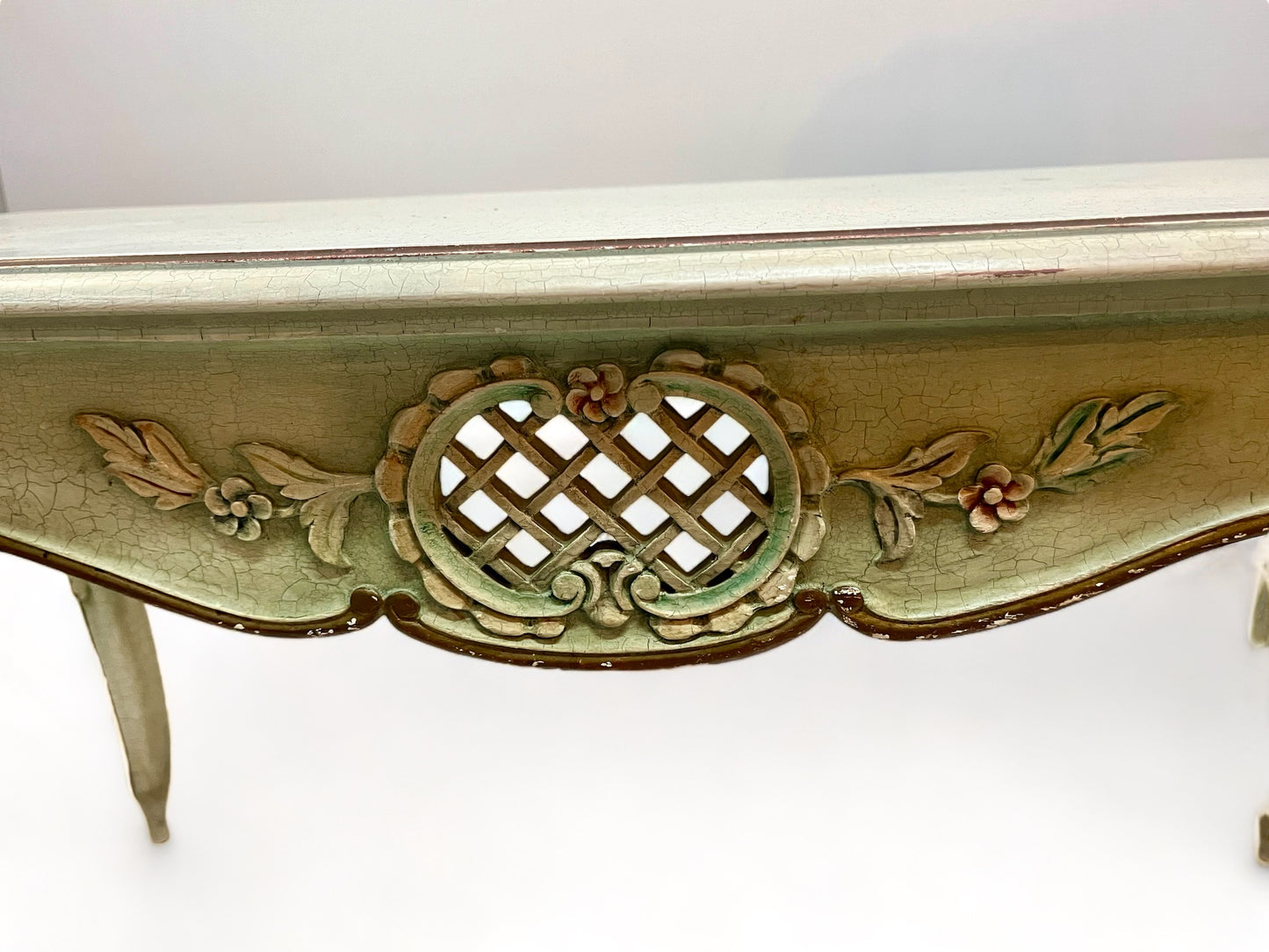 A vintage 1920 French carved, parcel gilt and painted with crackle finish coffee table