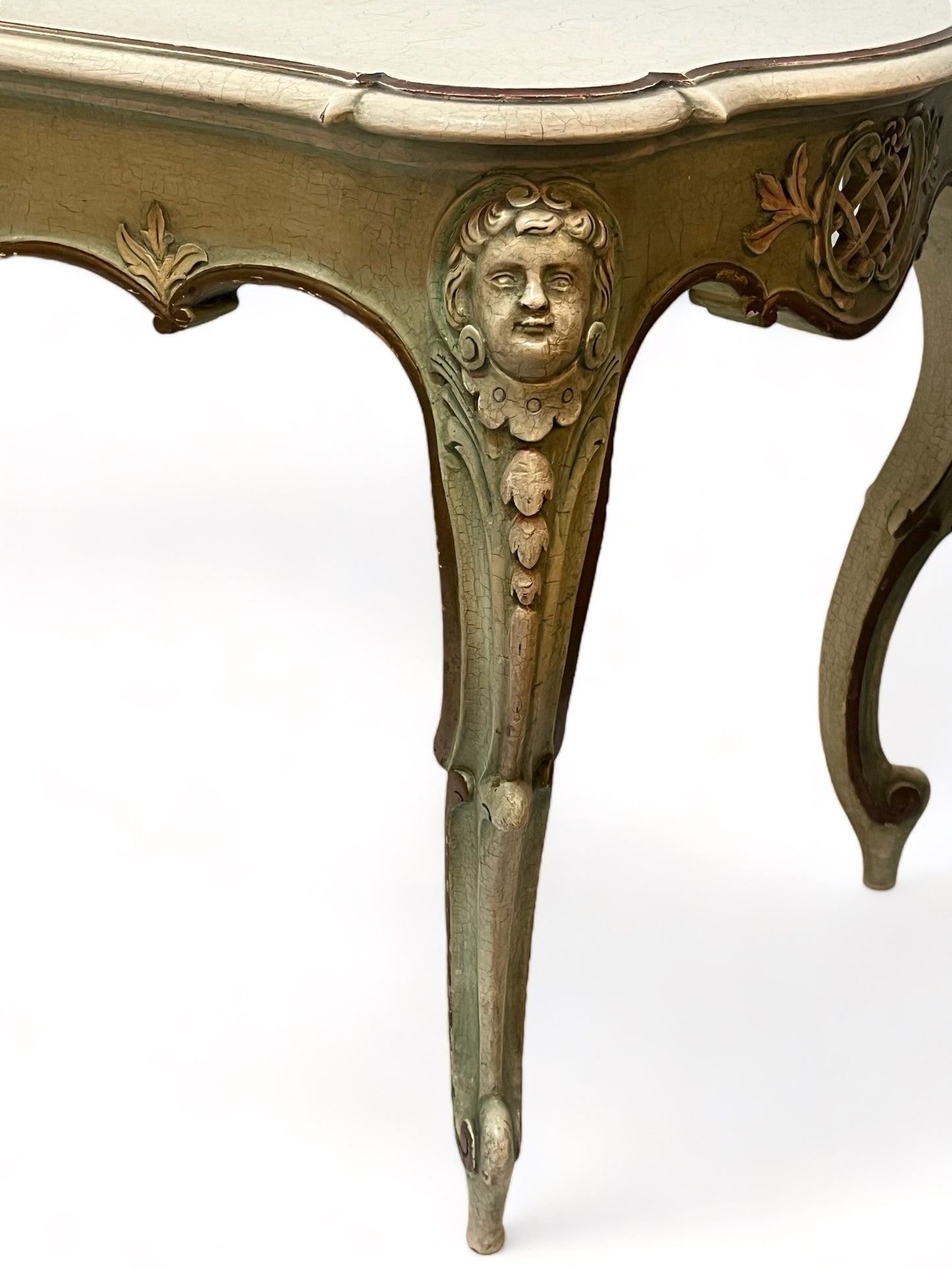 A vintage 1920 French carved, parcel gilt and painted with crackle finish coffee table