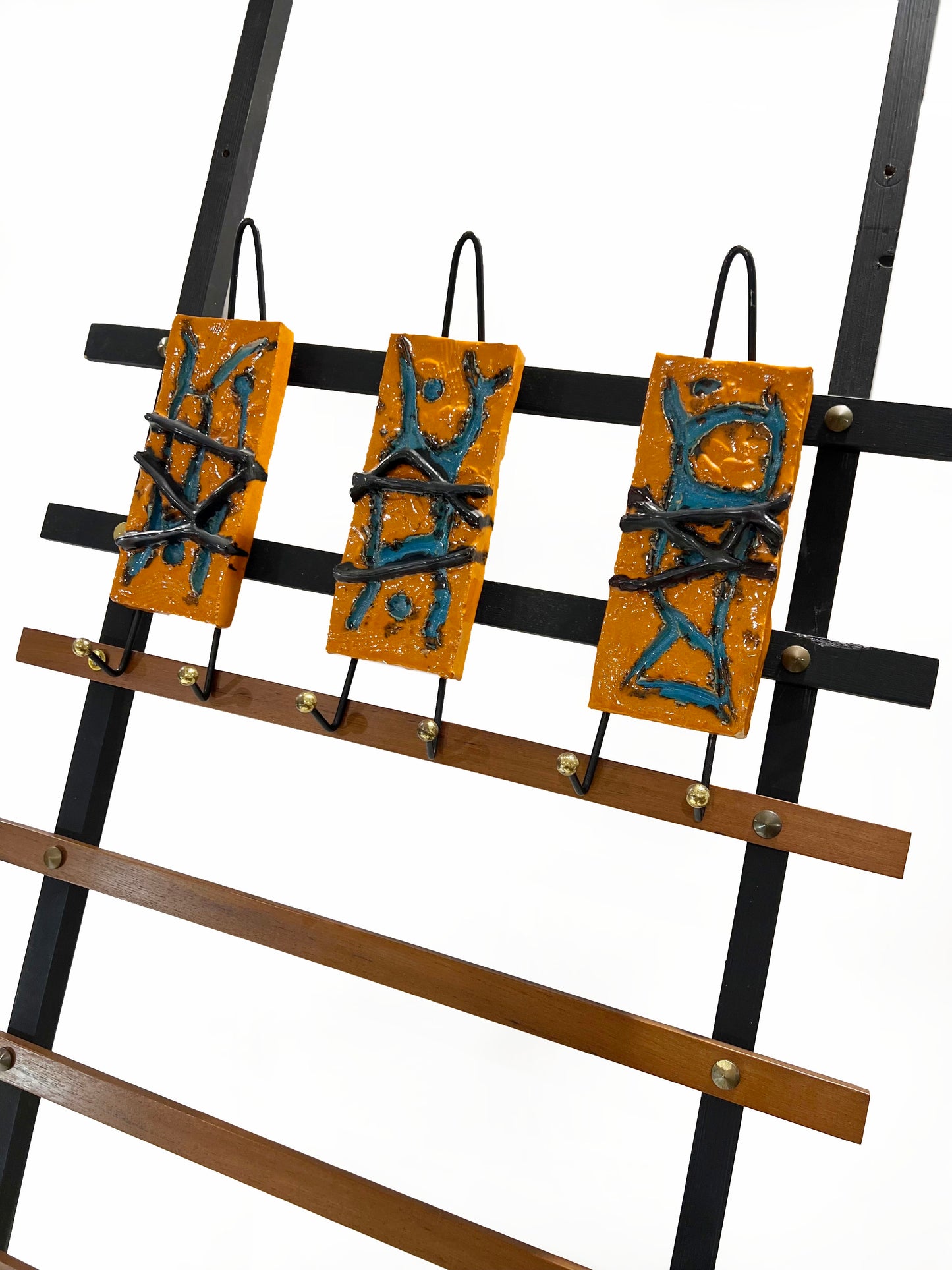 A pair of Italian mid century wall mounted hat or coat racks