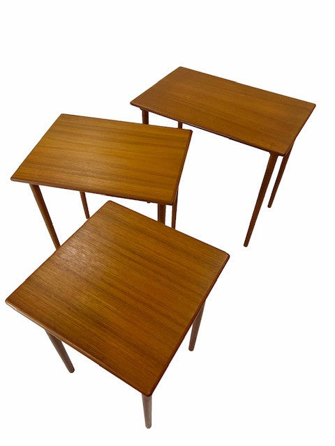 Nest of three teak tables