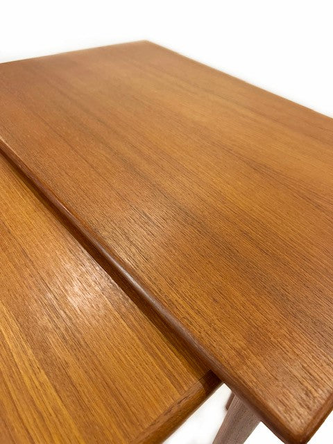 Nest of three teak tables