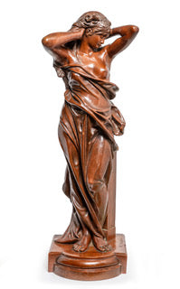 Antique art nouveau figure of a beautiful young madden in a typical art nouveau pose