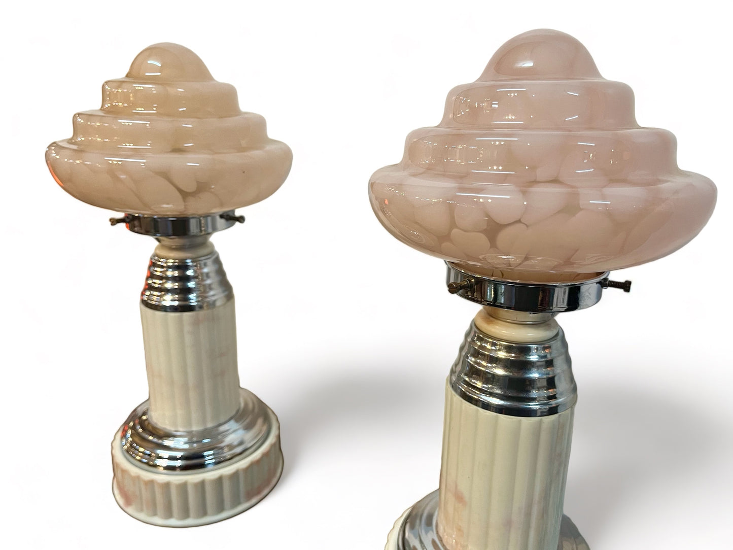 A pair of vintage 1930 white bakelite and chrome column, with shades of pink, art deco table lamps.