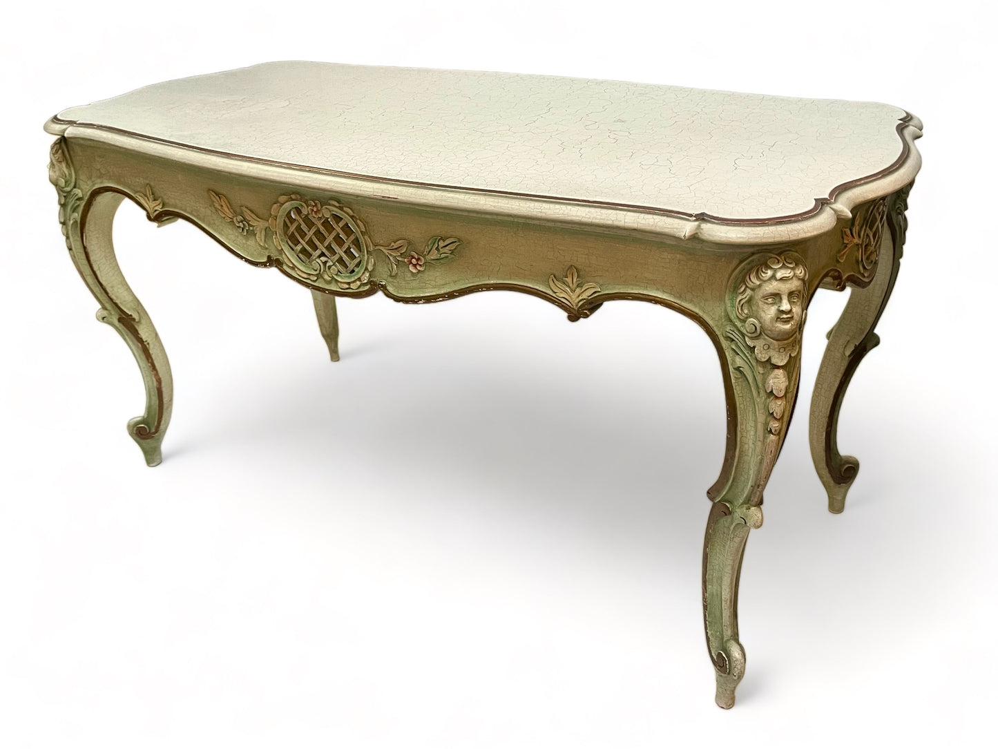 A vintage 1920 French carved, parcel gilt and painted with crackle finish coffee table