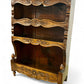 A antique 19th century French carved oak free standing spice rack, decorated with carved foliage on the front
