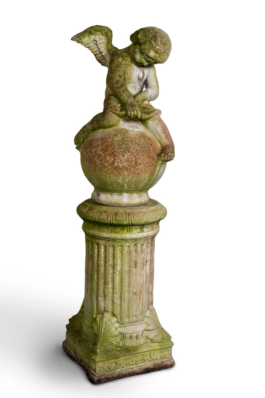 Reconstituted stone cupid on column garden statue