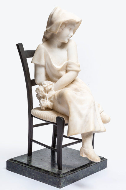 French carved Carrara marble figure of a young maiden seated in a bronze ladder back chair