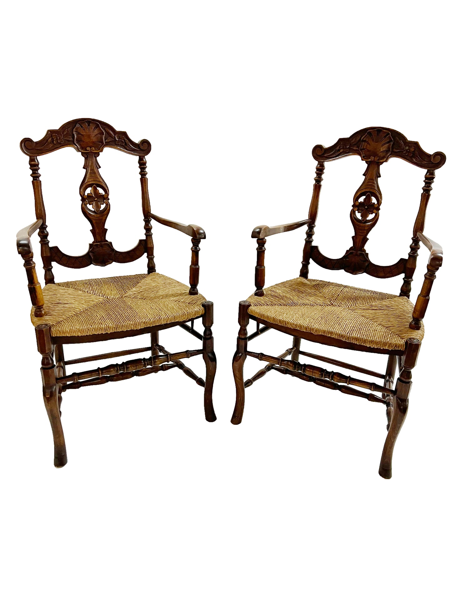 A pair of French oak armchairs.